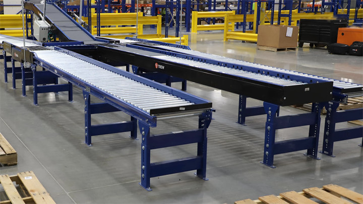 Three runs of conveyor runs inside a warehouse