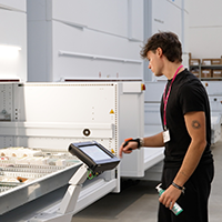 Employee picks from a vertical lift module