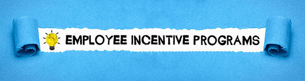 Text &ldquo;employee incentive programs&rdquo; revealed by rolling back blue fabric.