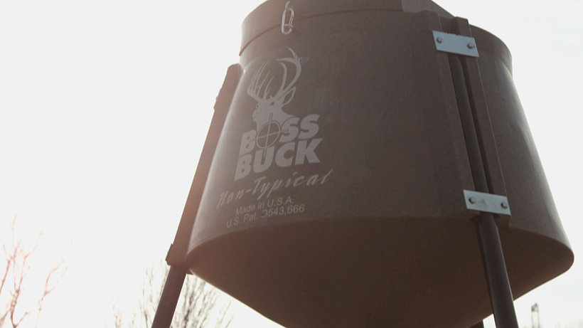 Boss Buck tripod deer feeder in the field while diagnosing a feeder that will not spin
