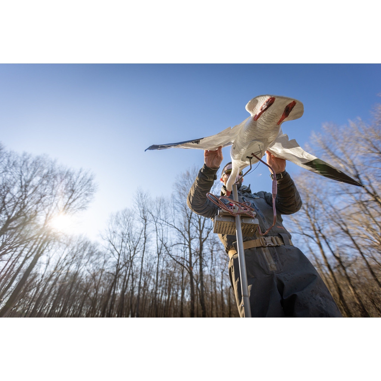 Higdon Clone flapping wing decoy on a water stand over flooded timber