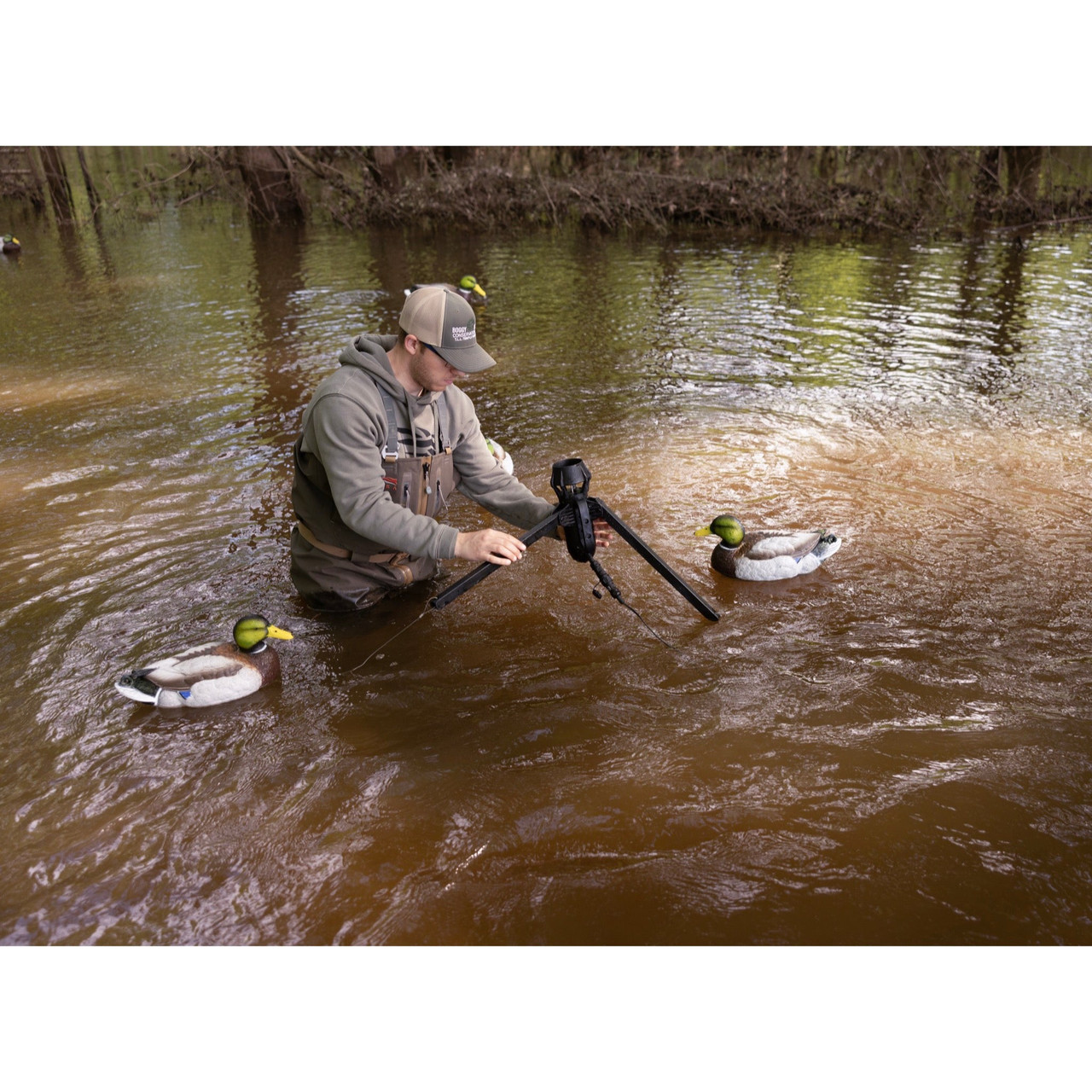 Hunter deploying a Higdon Motion Machine in shallow water