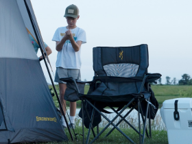 Tent pitched at a campsite in morning light