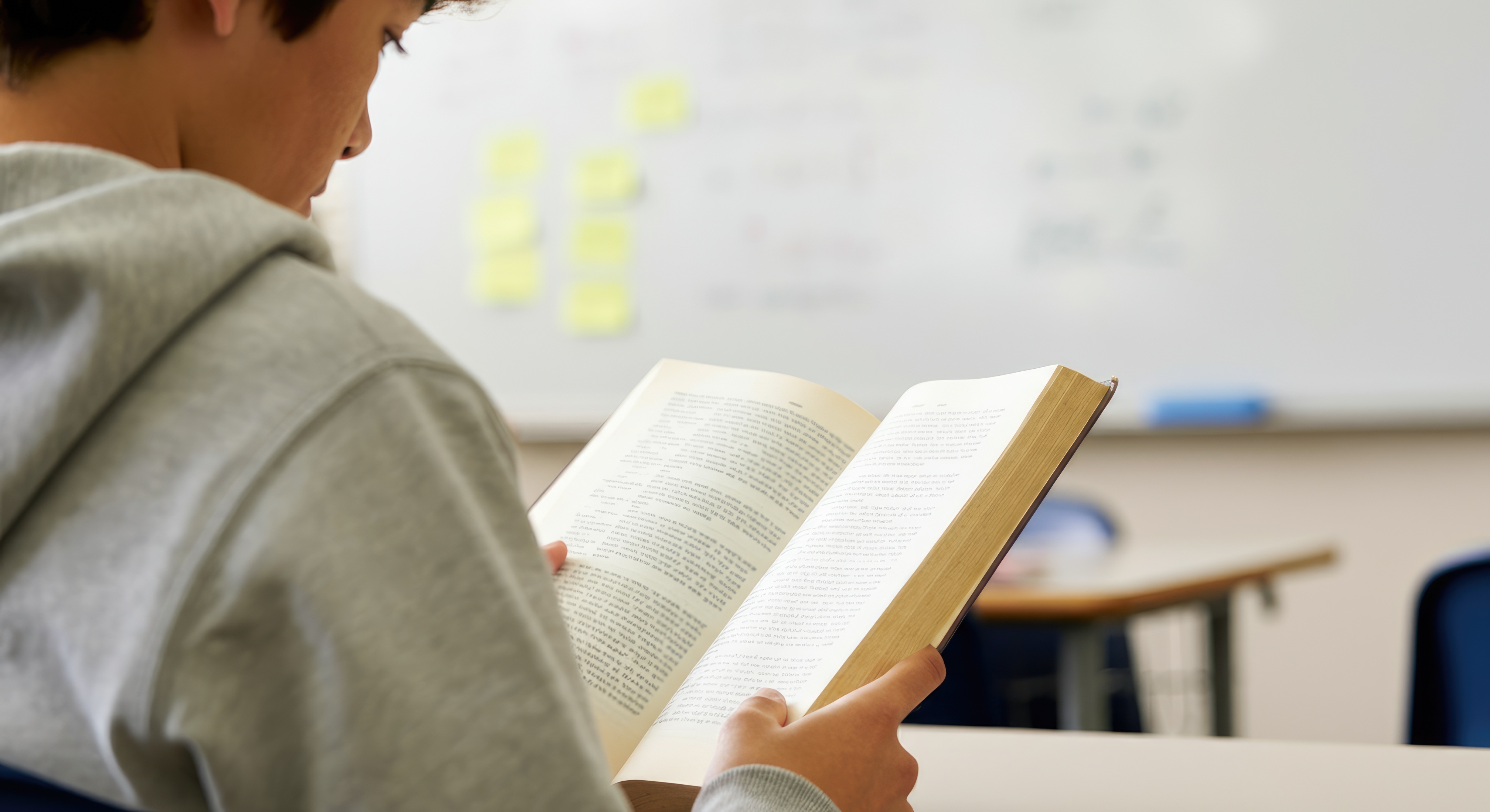 Person reading, over shoulder