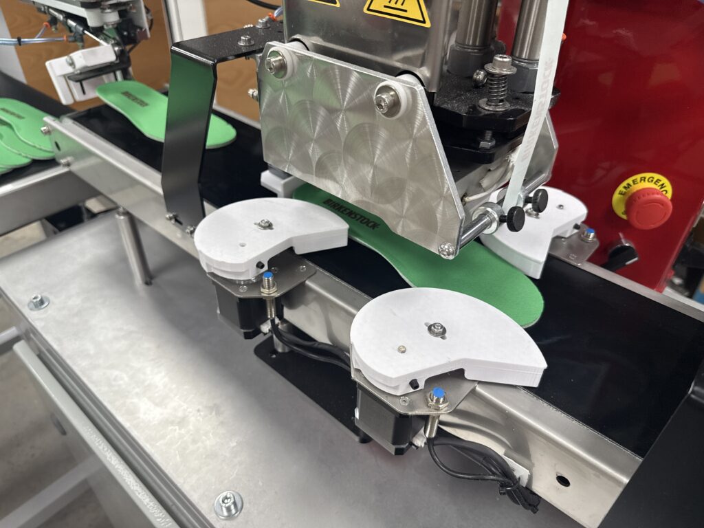 InnoPrinter automated conveyor shoe insole printer, a custom bespoke heat transfer configuration built by Supply55
