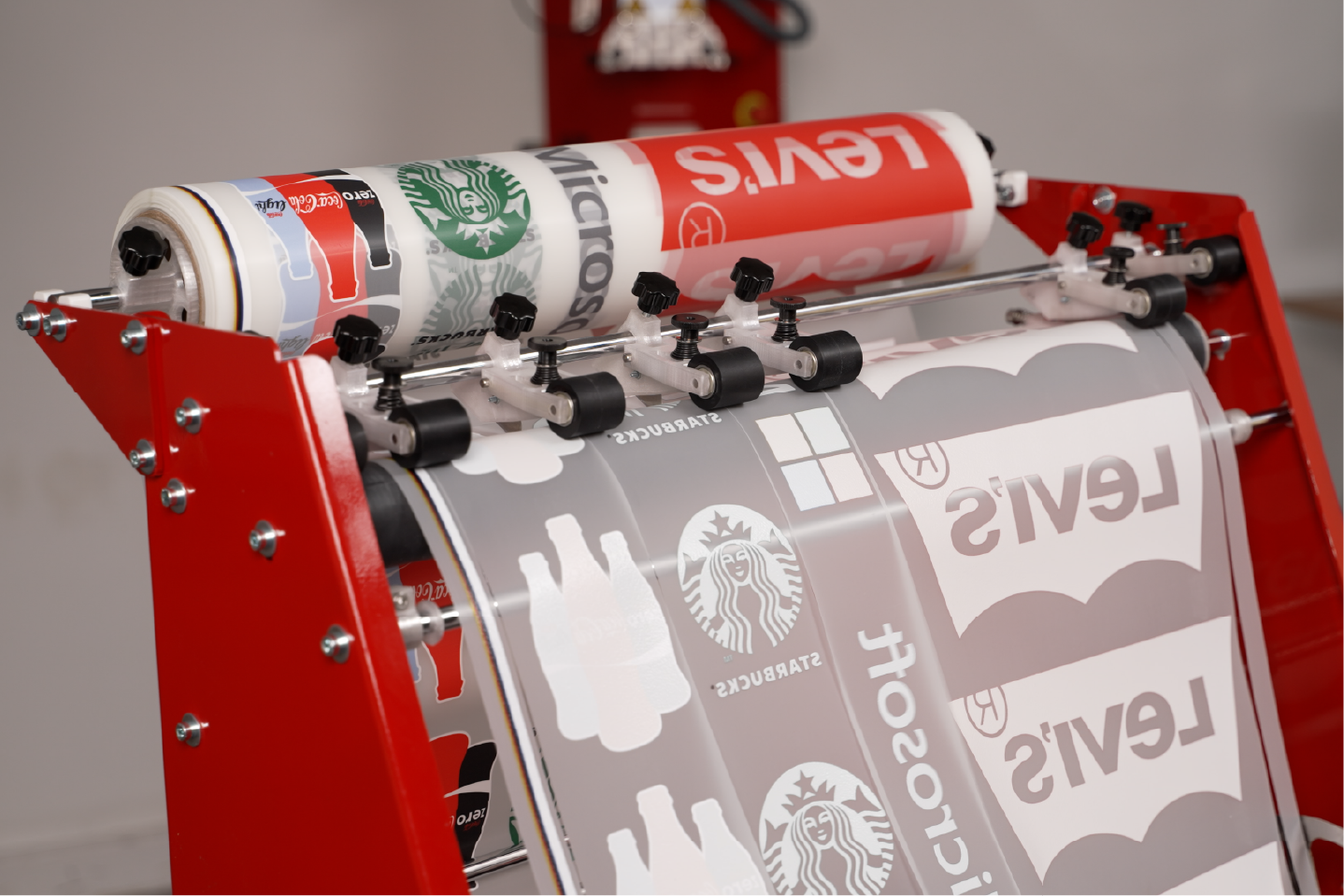 InnoPrinter DTF roll slitter converting wide printed film into narrow production-ready rolls