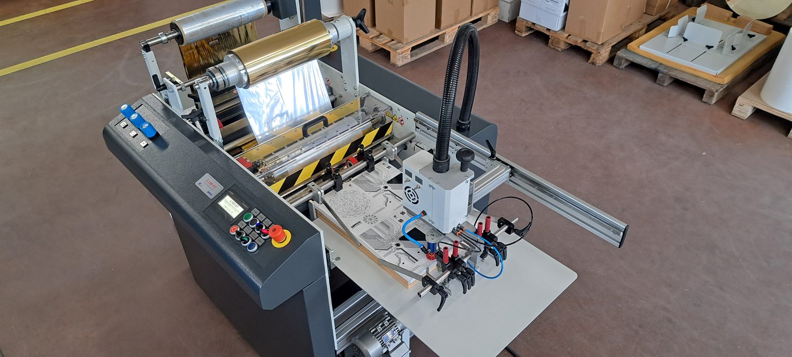 ZFP L100 ST top suction feed head drawing printed sheets from the pile across the extended feed table
