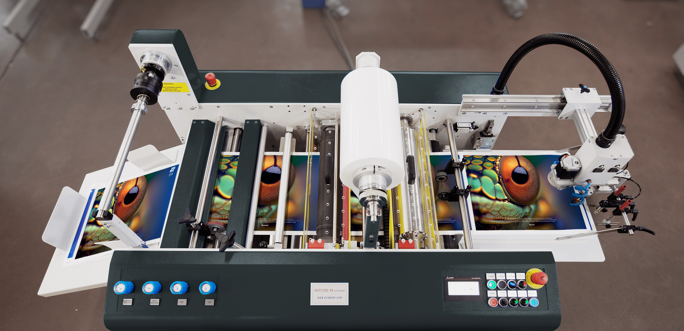 Top view of the ZFP L100 PB showing printed sheets running through both laminating stations