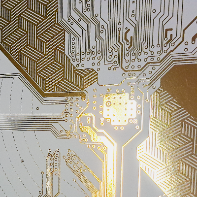 Digital gold foil embellishment applied to a printed sheet