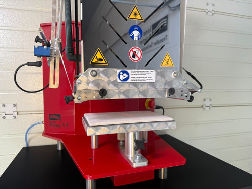 InnoPrinter MK2 roll-to-roll semi-automatic heat press with the full-size mid-format platen installed for logo and chest prints