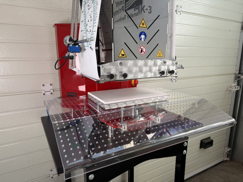 InnoPrinter MK3 roll-to-roll semi-automatic heat press mounted on a clear pin positioning table for fast, repeatable garment placement