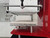 Side profile of the InnoPrinter MK3 roll-to-roll heat press showing the laser alignment line on the full-size heated platen