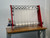 Full view of the InnoSlitter RC90 high-speed DTF roll slitter on its bench, converting wide printed transfer