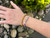 Here, the Wood You? FosterClub friendship bracelet is paired with our I Heart FosterClub bracelet. It's a great pairing to show strong support for FosterClub and children who experience foster care!