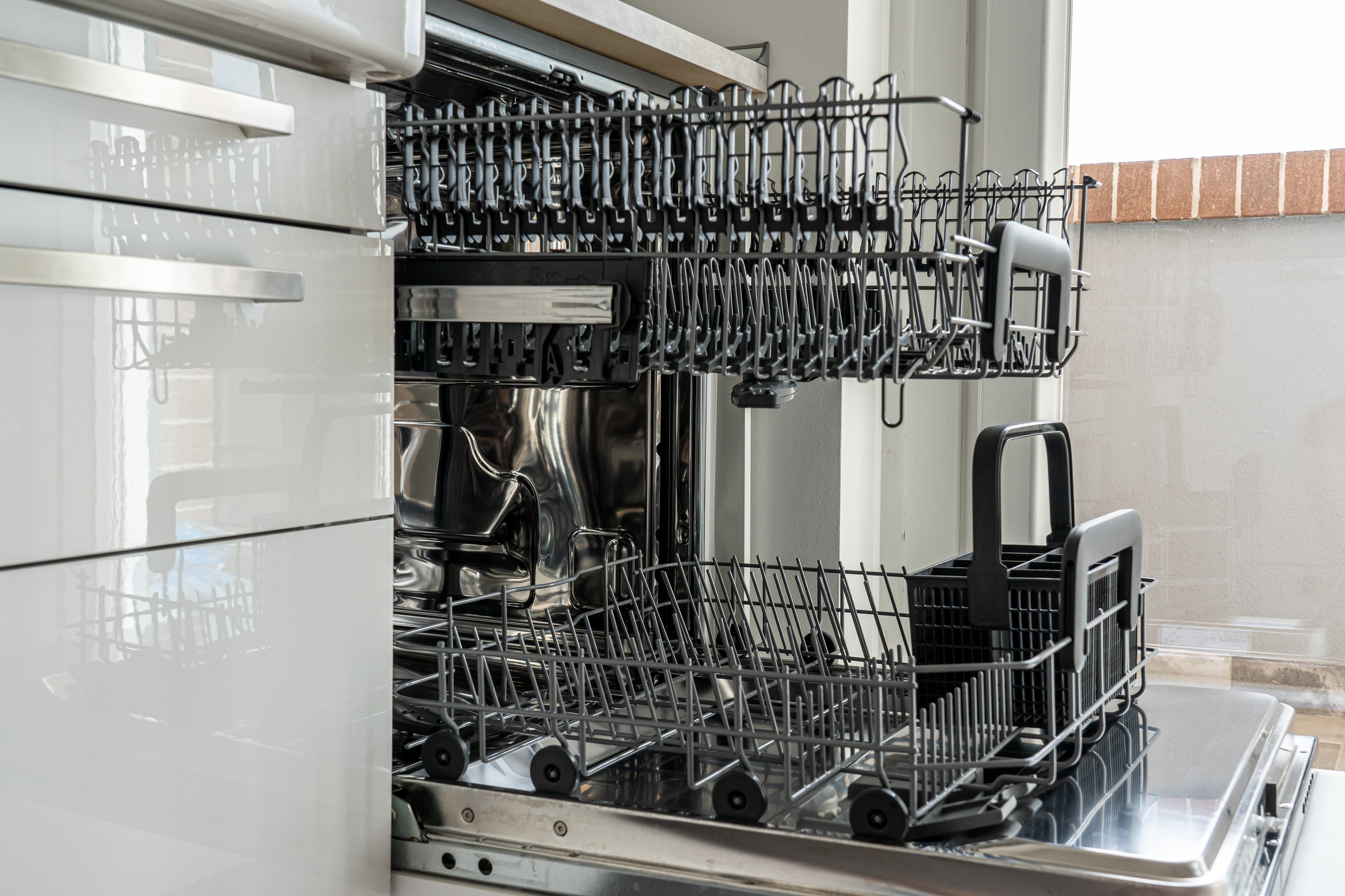 Diswasher opened and showing drawers