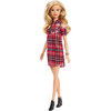 Barbie doll wears a cool shirt dress in red plaid with cut-out shoulders.