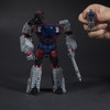 1.25 inch (3 cm) Titan Master figure becomes the head of the Decepticon Quake figure.