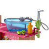 A removable tub fits on top of the station, where a shower-head and hose make bath time easy; remove the tub to make room for grooming with the pet brush.