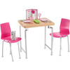 The" wooden" table and two pink chairs have silvery legs for a modern touch.