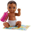 The baby doll has movable arm and leg joints so that it can be put to sleep and sits on its blanket.