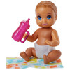 The baby doll has movable arm and leg joints so that it can be put to sleep and sits on its blanket.