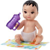 The baby doll has movable arm and leg joints so that it can be put to sleep and sits on its blanket.