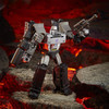 Comes with Fusion Cannon and blaster accessories. Blaster accessory is inspired by the G1 alt mode of Megatron and can connect to his Fusion Cannon accessory.