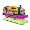 Thomas & Friends Hyper Glow Nia motorized toy train features lights that leave a glowing trail on glow-in-the-dark TrackMaster track.
