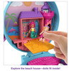 Compact measures around 4.75 inches (12 cm) when closed. Micro Polly doll measures around 1.25 inches (3 cm) tall.