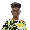 Ken doll has sculpted black curly hair