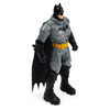 Battle Armor Batman wears a grey & black armoured suit which includes a cape.