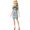 Barbie doll wears a teal dress with sweet floral print.