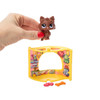 Brown Pomeranian pet comes with Piñata Party Pet Nook, Dog Treat accessories, a collector card, a special virtual code, and a guide to track your collection