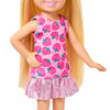 This 5.25-inch (13.5 cm) doll is super-cute in a pink dress with a ruffled hem and colourful print themed to strawberries