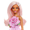 Barbie doll has a petite body type! She accessorises her pastel pink hair with a pearly barrette that shows off her polished style