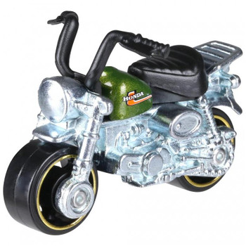 Authentically styled Honda Monkey Z50 motorcycle in green.

