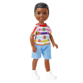 This 5.25-inch (13.5 cm) boy doll is super-cute in a one-piece look with a striped shirt and blue shorts -- emojis add a fun, trendy touch. White high-top trainers complete the look.