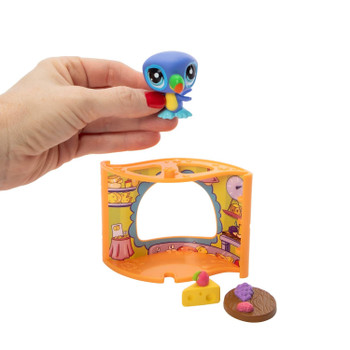 Purple Toucan pet comes with French Bistro Pet Nook, Cheese Board accessories, a collector card, a special virtual code, and a guide to track your collection