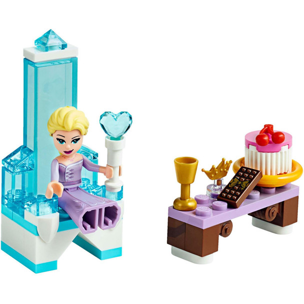 Build a beautiful ice throne and scepter for Elsa and place the crown on her head, then add a table with a buildable cake, chocolate bar and drink for her to enjoy!