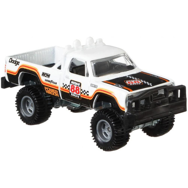 This 1980 Dodge Macho Power Wagon has a white & black deco with orange & red detailing and authentic sponsor logos.