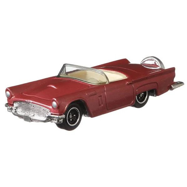 1957 Ford Thunderbird in Metalflake rose red with chrome details.