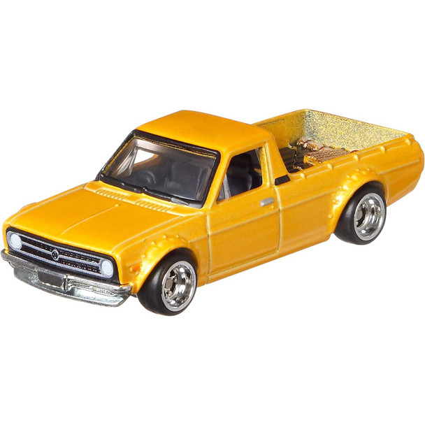 This 1975 Datsun Sunny Truck (B120) has a Metalflake yellow finish.