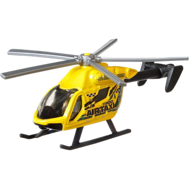 The Matchbox Sky Busters Airblade helicopter features a yellow and black 'Air Taxi' deco.