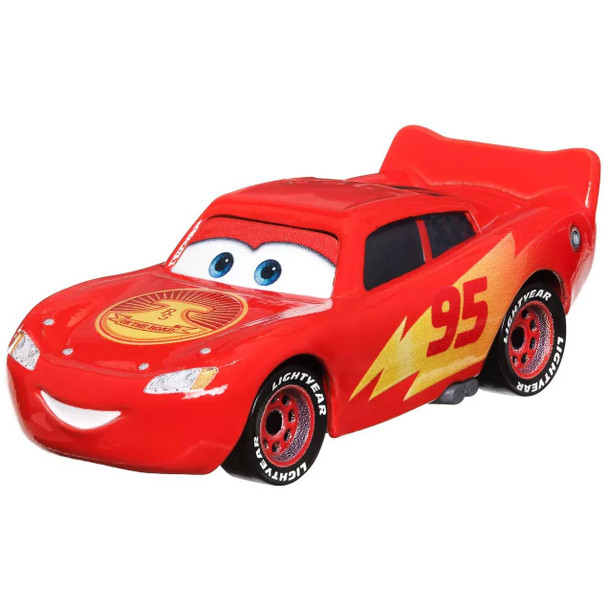 As seen in the Disney+ miniseries Cars On The Road, Road Trip Lightning McQueen features authentic styling, big personality details, and wheels that roll.