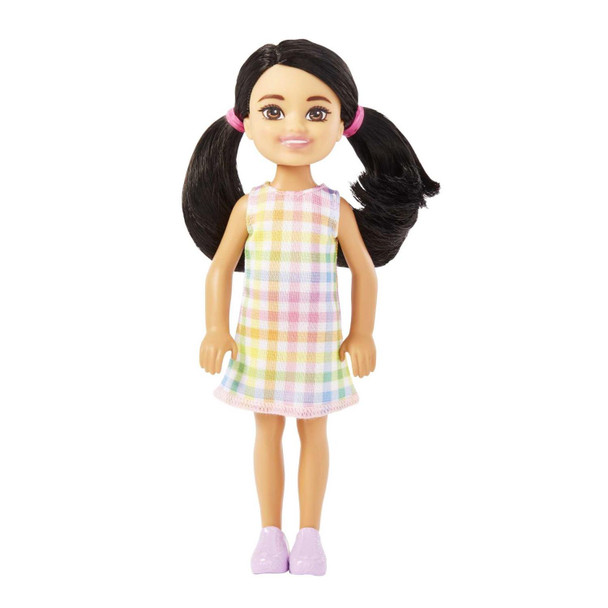 This 5.25-inch (13.5 cm) Chelsea doll is super-cute in a white dress with pastel plaid print.
