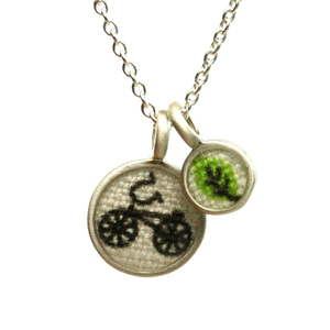 Bike and leaf duo pendant