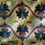 M01 gold metallic background with black and lime green flowers and Red ribbons in symmetrical pattern