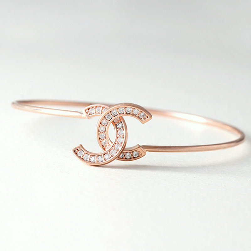 Swarovski Rose Gold Horseshoe Knot Bangle Bracelet from kellinsilver.com