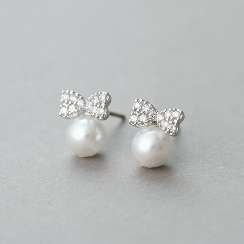 Tiny Cz Bow Pearl Stud Earrings White Gold from kellinsilver.com