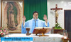 In the Philippines, Father Jeffrey Quintela celebrates Mass before a framed image of Our Lady of Guadalupe life sized tilma.